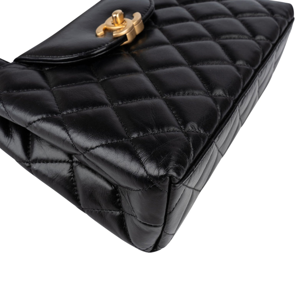 Bolso de mano Chanel Kelly pequeño con asa superior y bandolera en piel de cordero acolchada