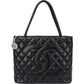 Bolso de mano Chanel Medallion CC Tote en piel Caviar acolchada