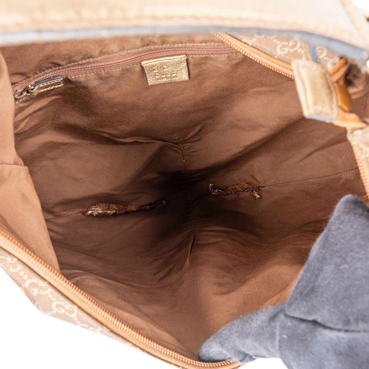 Borsa a spalla Gucci Britt Interlocking G Hobo in tela Monogram GG oro