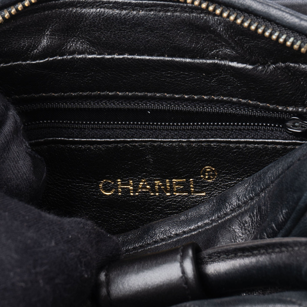 Bolso Chanel Iconic Camera Looping Circle de piel de cordero acolchada